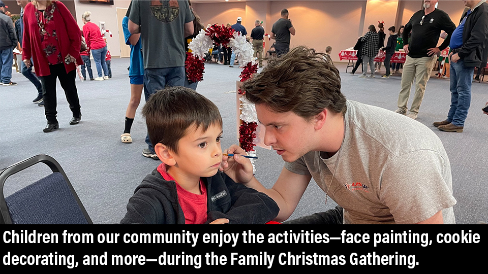 Children from our community enjoy the activities—face painting, cookie decorating, and more—during the Family Christmas Gathering.